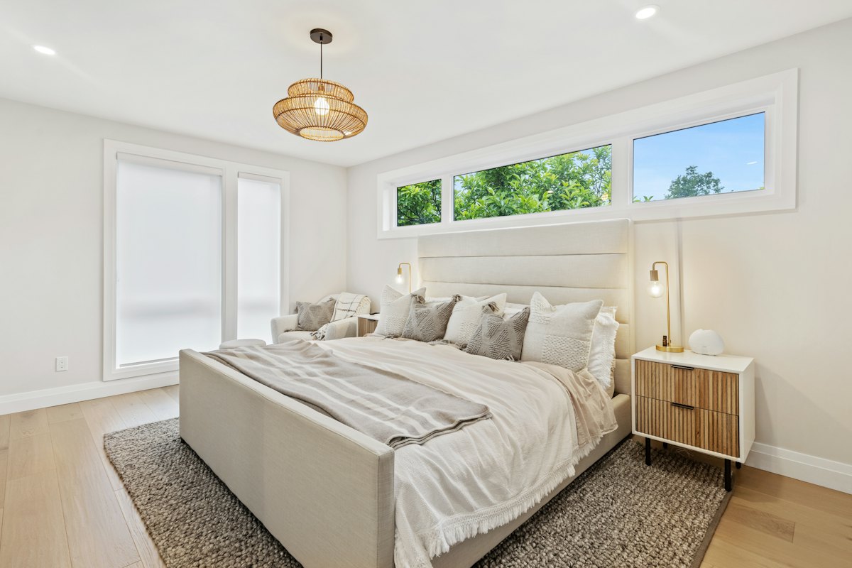 Guest-ready rental bedroom with freshly made bed